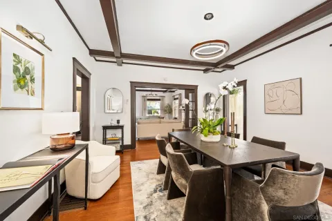 a dining room with furniture and window