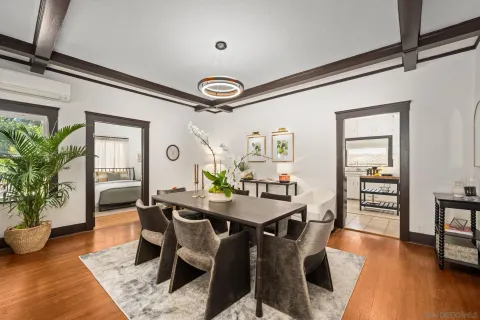 a view of a dining room with furniture and wooden floor