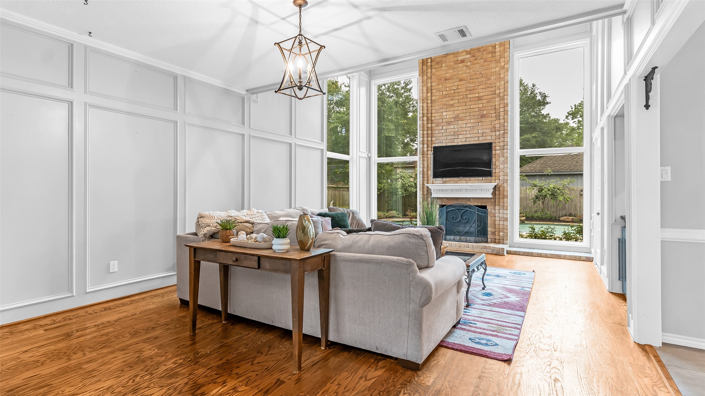 2607 Laurel Ridge Drive Houston, TX 77345 - Photo 10 of 47 a living room with fireplace furniture and a large window
