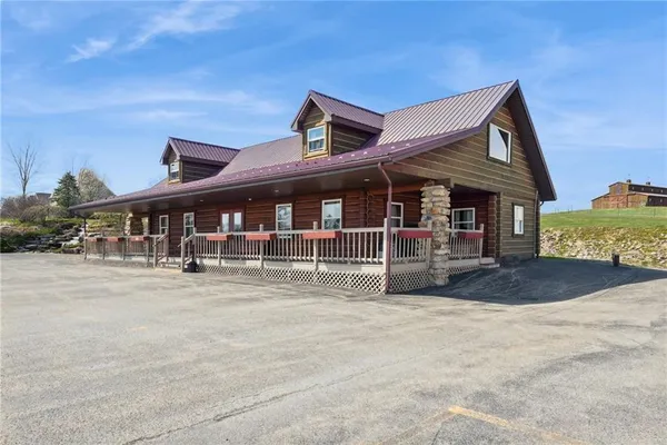 a front view of a house with a porch