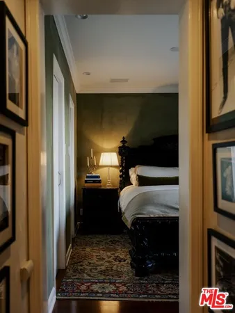 a bed room with a bed tv and a television