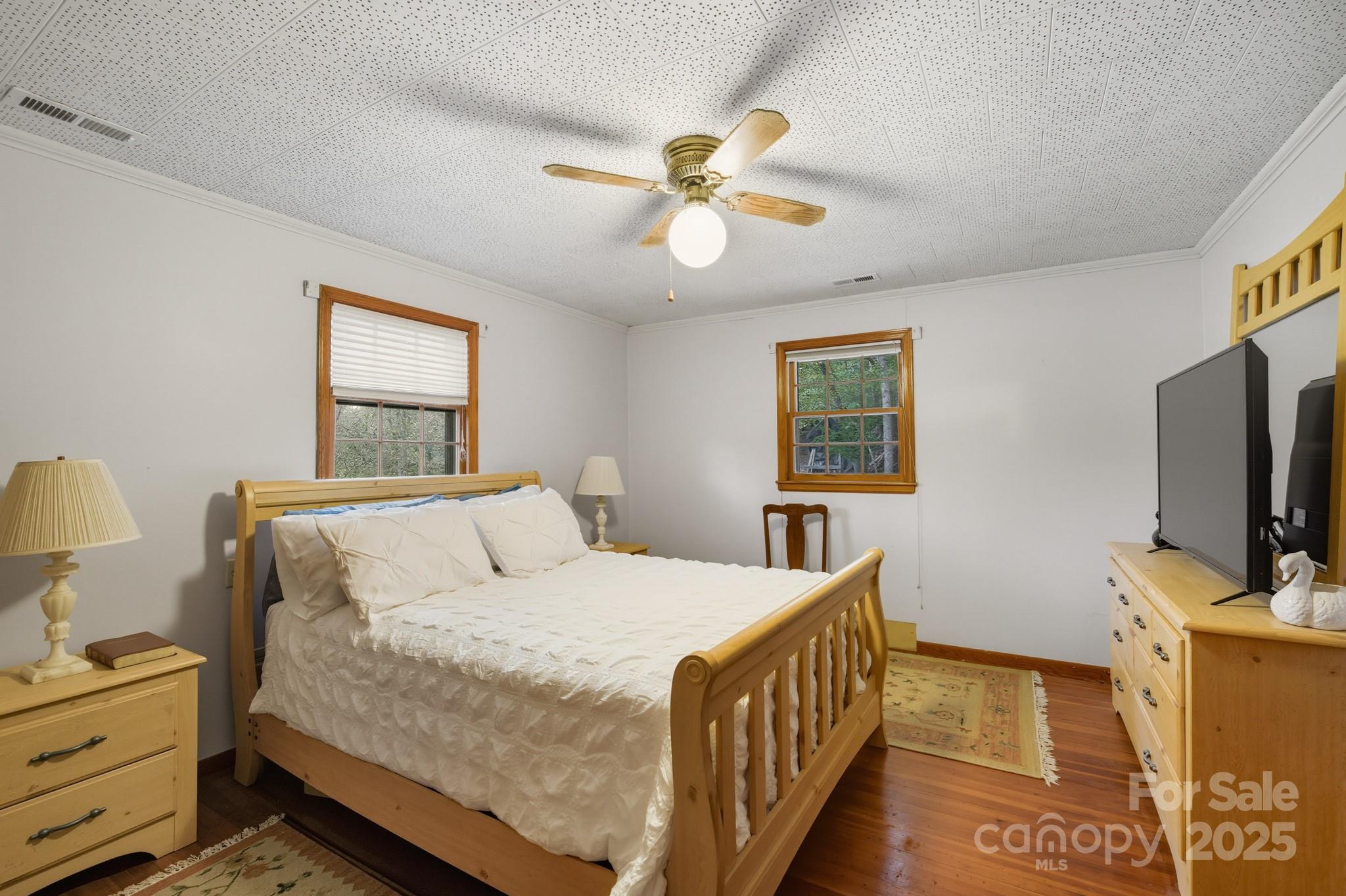 636 Maple Creek Road Rutherfordton, NC 28139 - Photo 5 of 17 a bedroom with a bed and a tv on the dresser