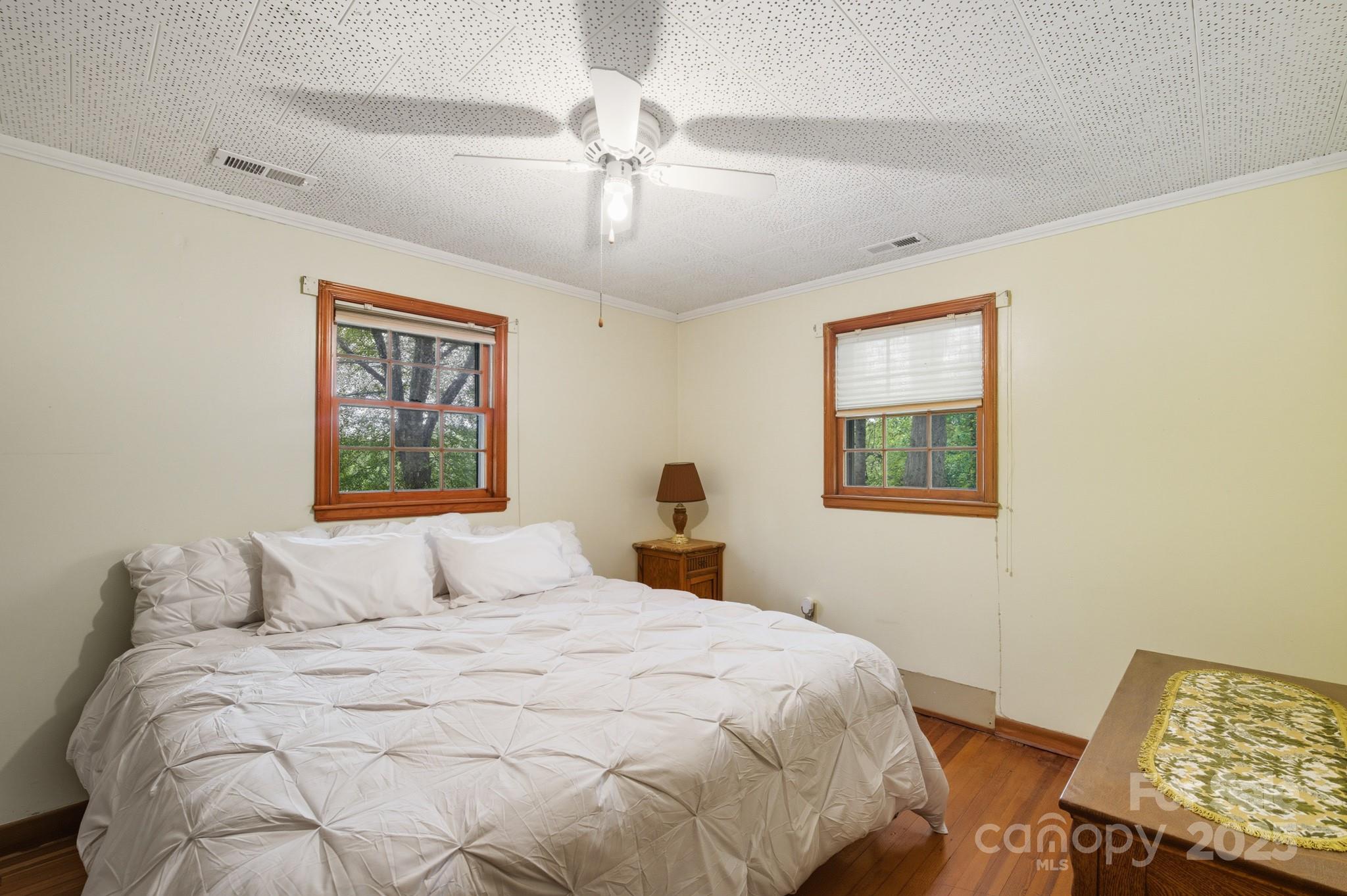 636 Maple Creek Road Rutherfordton, NC 28139 - Photo 6 of 17 a bedroom with a bed and a lamp on dresser
