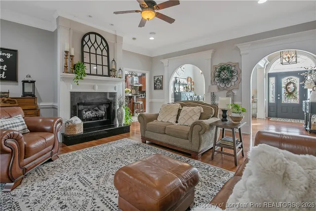 a living room with furniture and a fireplace