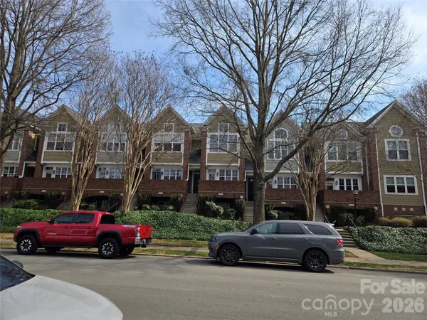 a cars parked in front of a brick building
