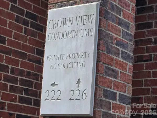 a sign on the wall of building