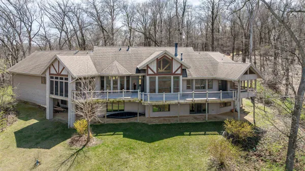 a view of house with a yard