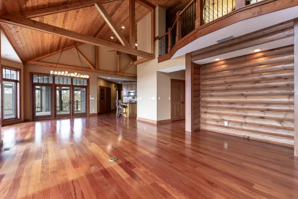 a view of an outdoor space with wooden floor and city view
