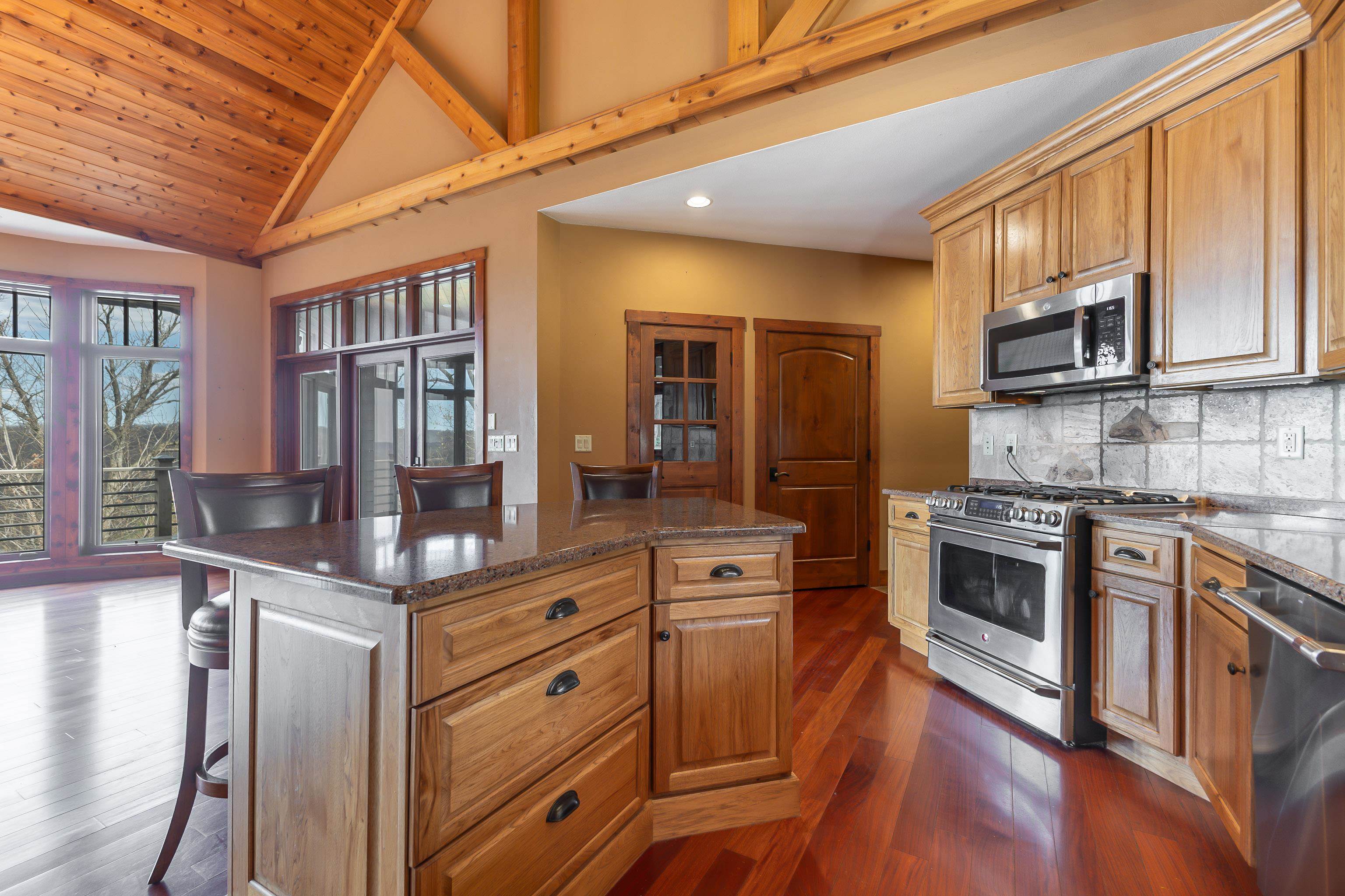 8616 Fisher Road Hanover, IL 61041 - Photo 23 of 74 a kitchen with stainless steel appliances granite countertop a stove and cabinets