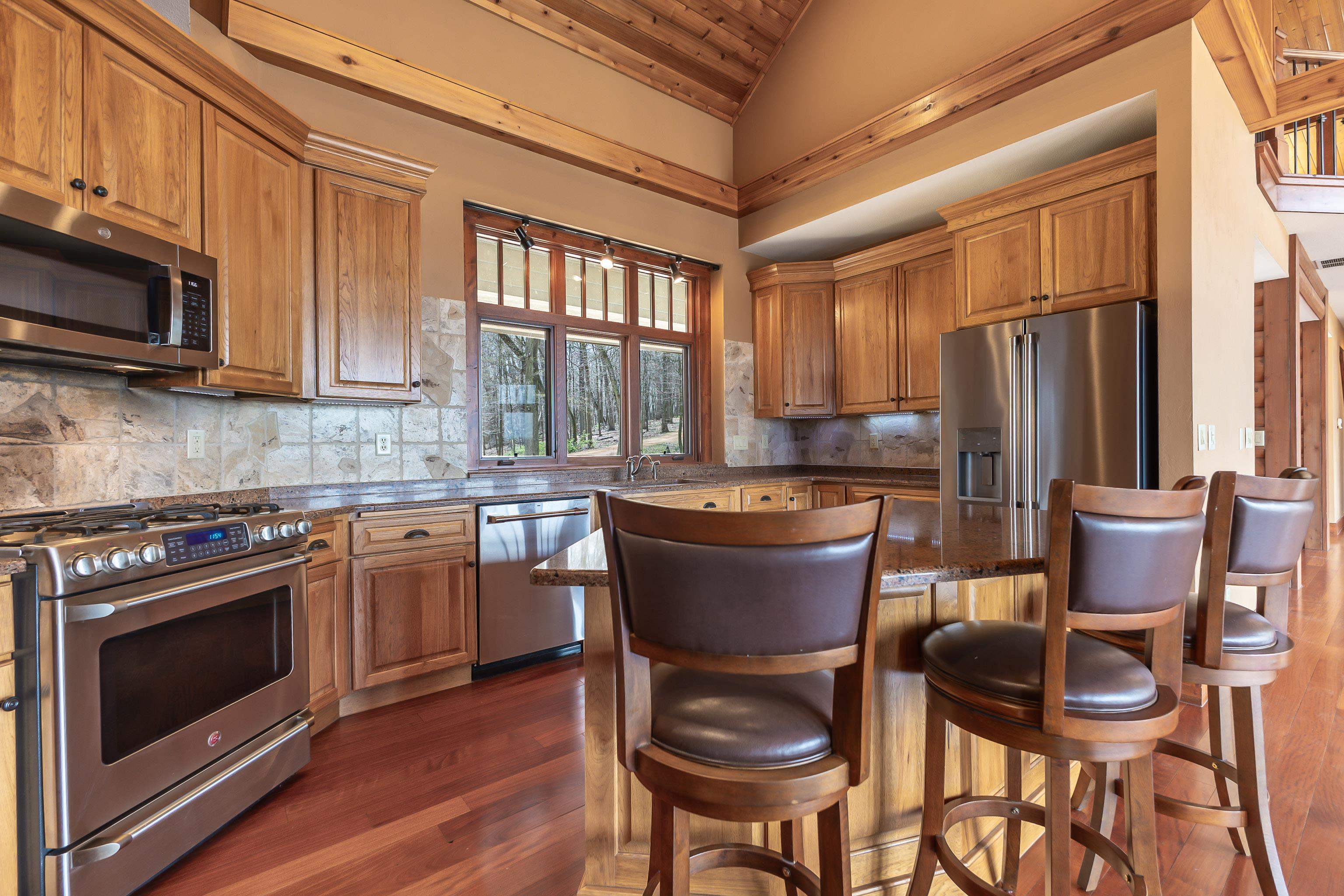 8616 Fisher Road Hanover, IL 61041 - Photo 24 of 74 a kitchen with a stove a sink and a microwave