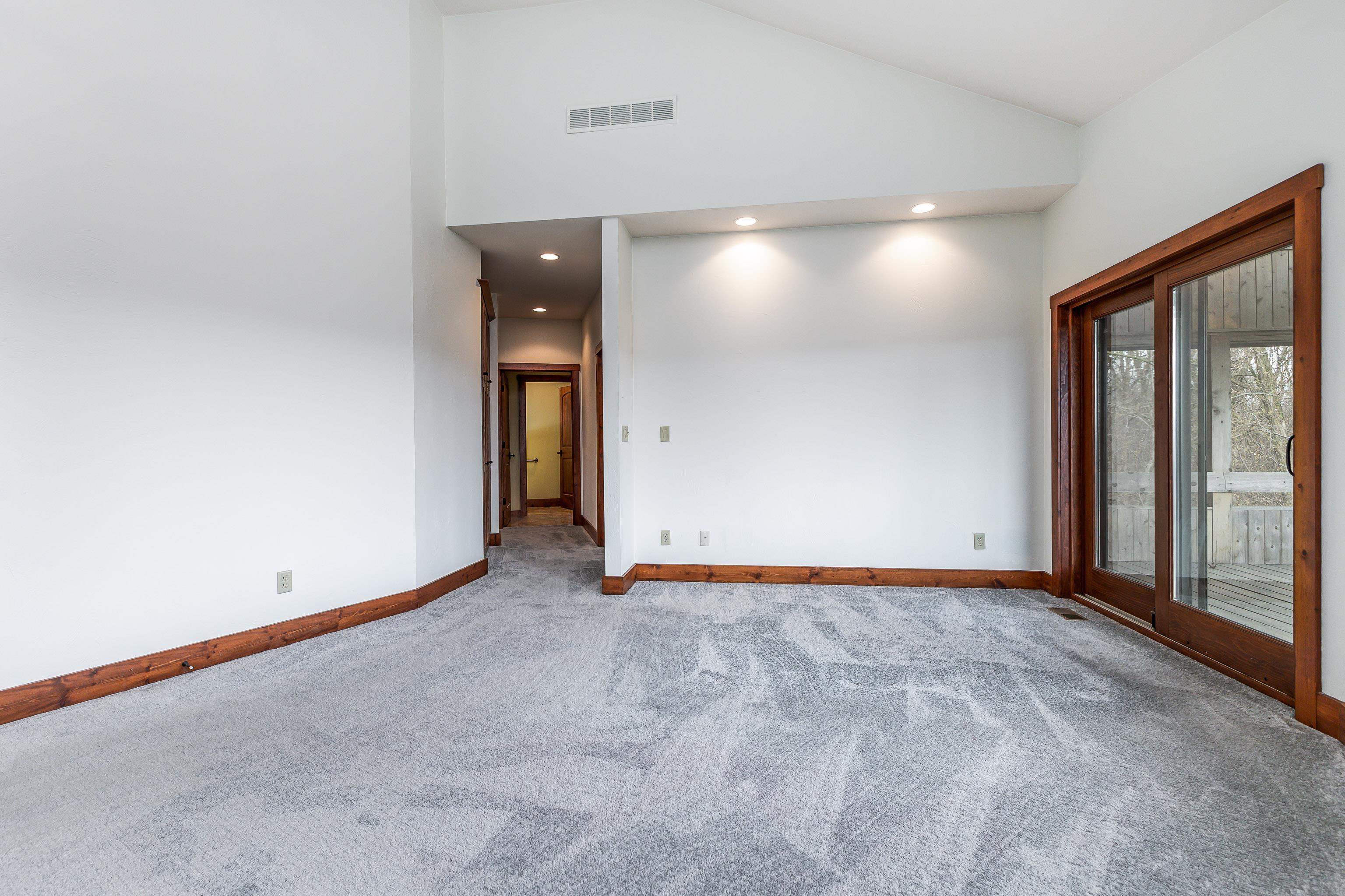 8616 Fisher Road Hanover, IL 61041 - Photo 35 of 74 an empty room with a projector and windows