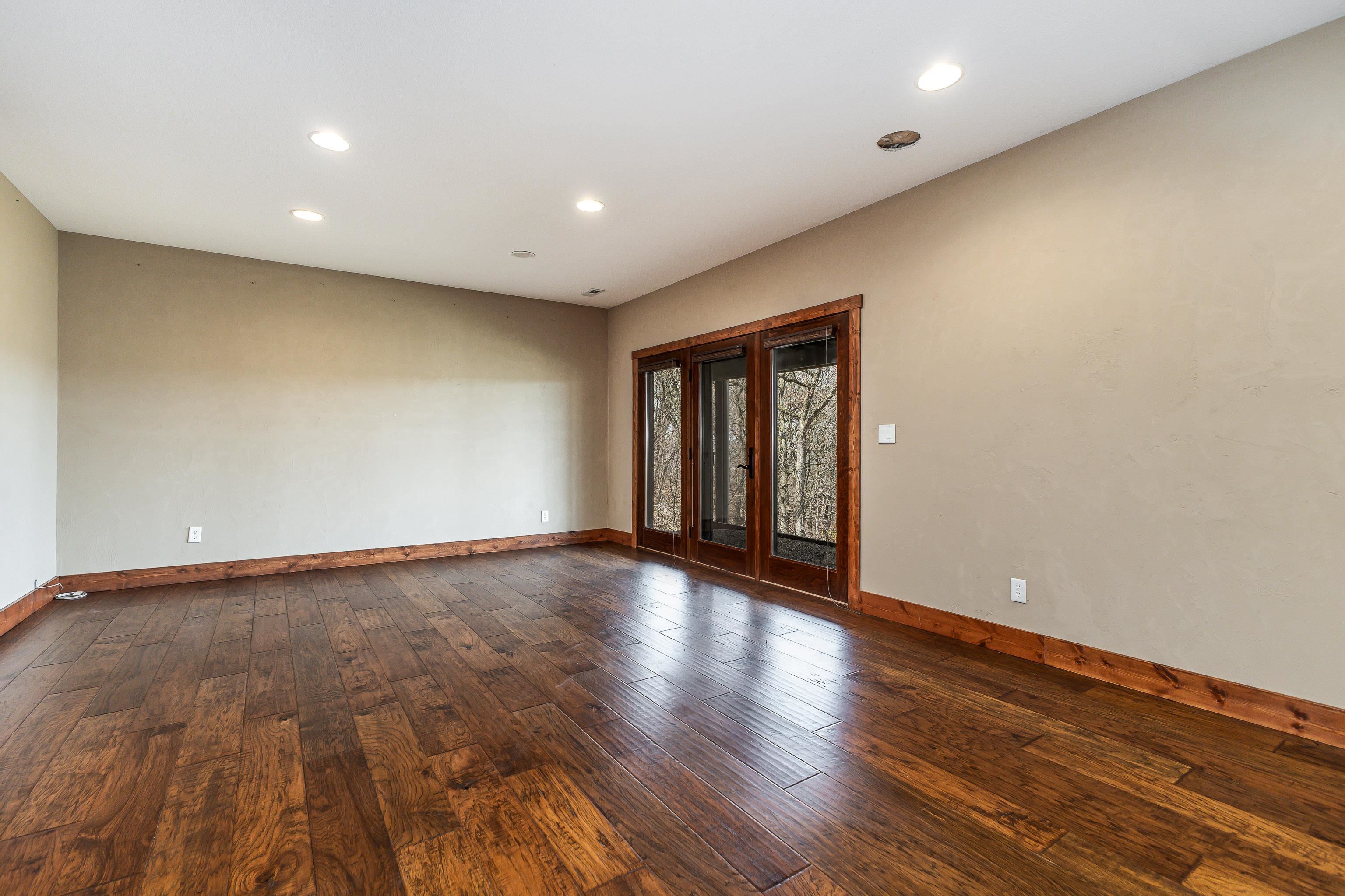 8616 Fisher Road Hanover, IL 61041 - Photo 51 of 74 a view of an empty room with wooden floor and window