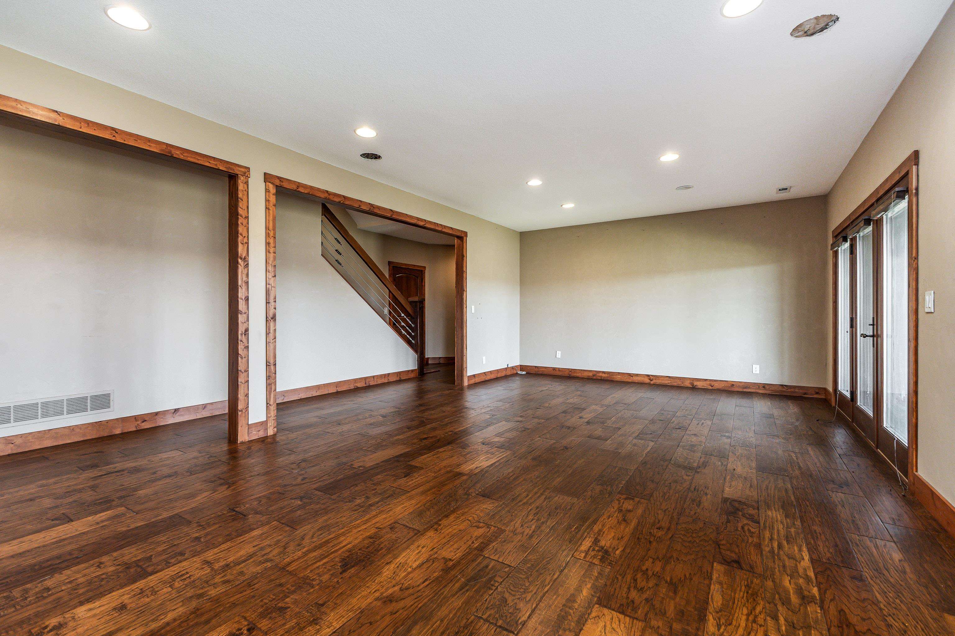 8616 Fisher Road Hanover, IL 61041 - Photo 52 of 74 an empty room with wooden floor and door