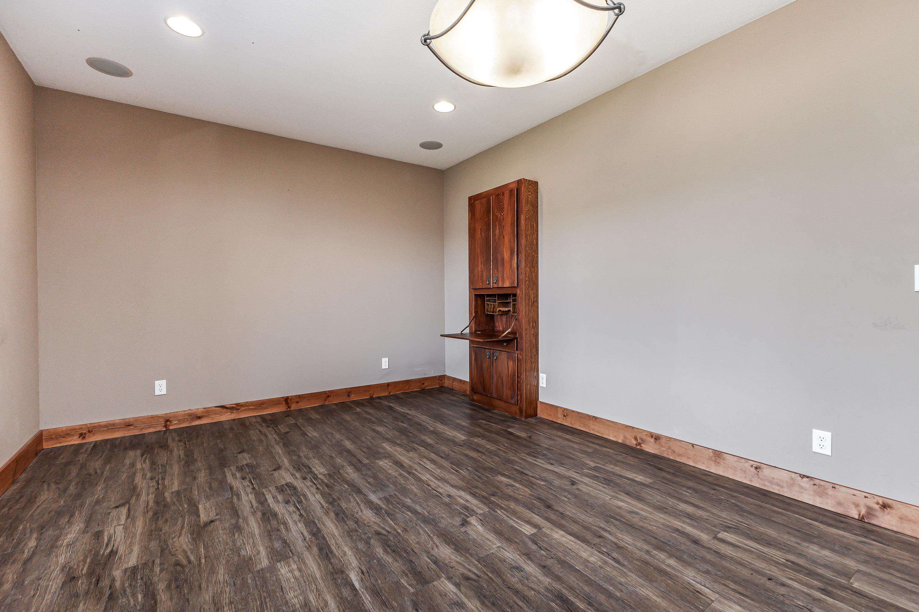 8616 Fisher Road Hanover, IL 61041 - Photo 54 of 74 a view of an empty room with wooden floor and a window