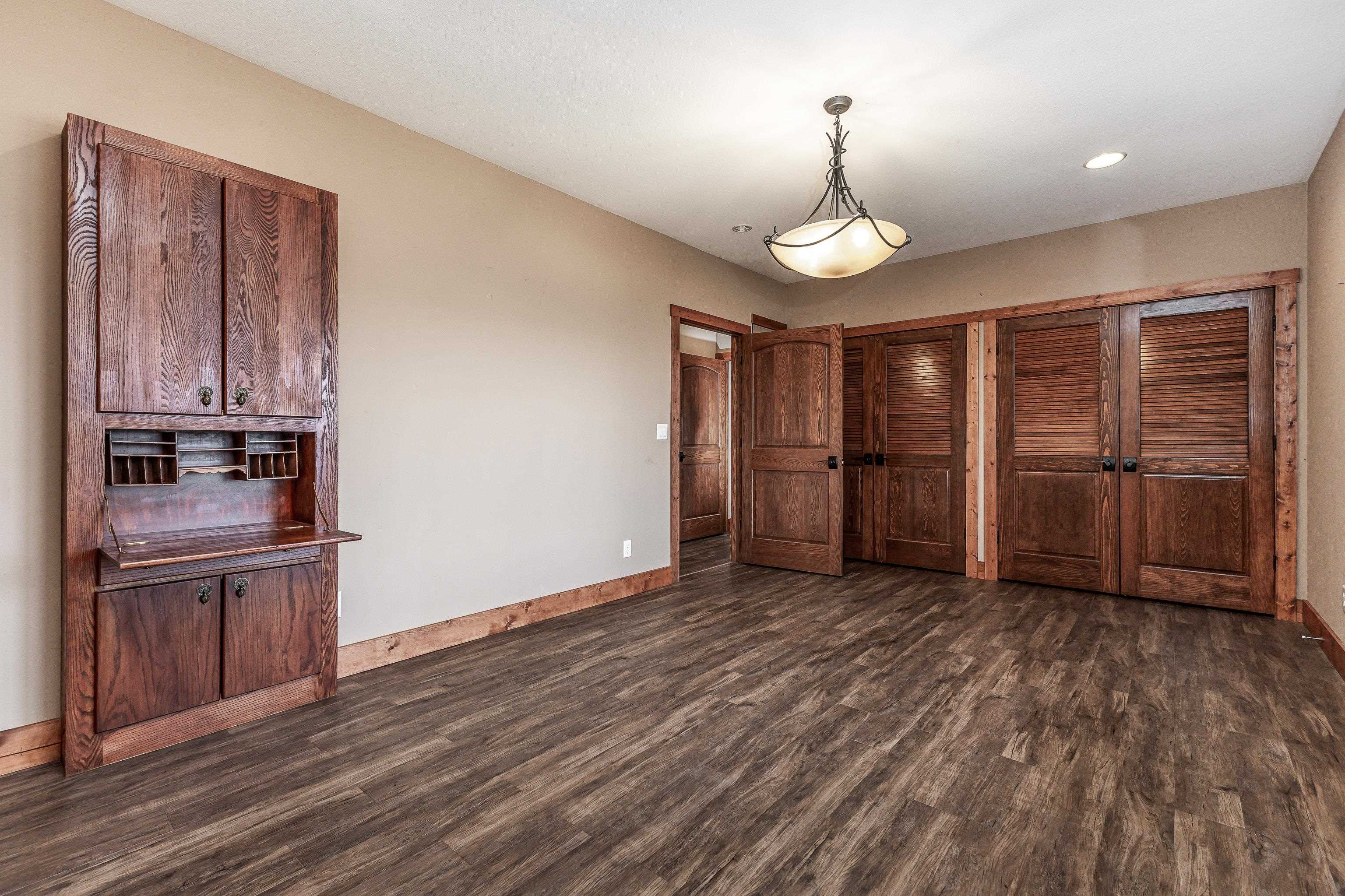 8616 Fisher Road Hanover, IL 61041 - Photo 55 of 74 an empty room with wooden floor closet and windows