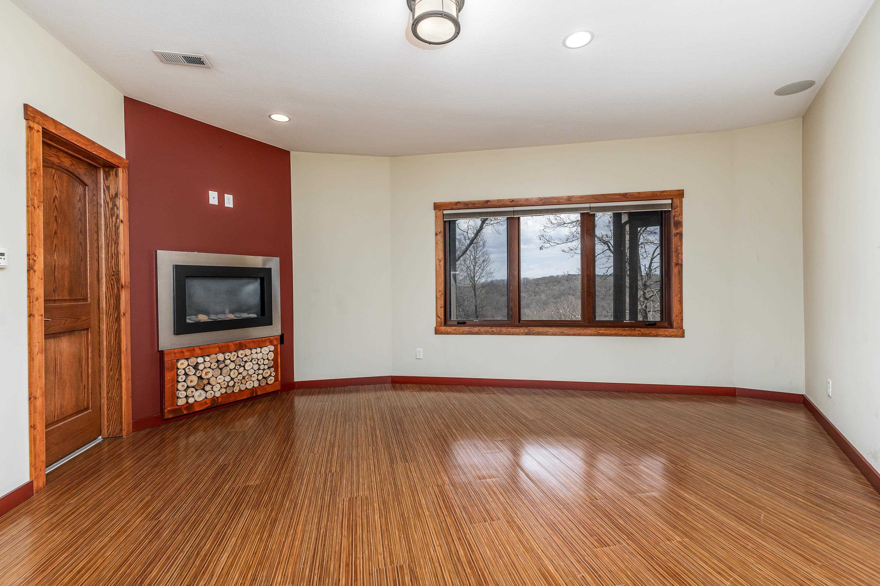 8616 Fisher Road Hanover, IL 61041 - Photo 56 of 74 a view of an empty room with wooden floor and a window