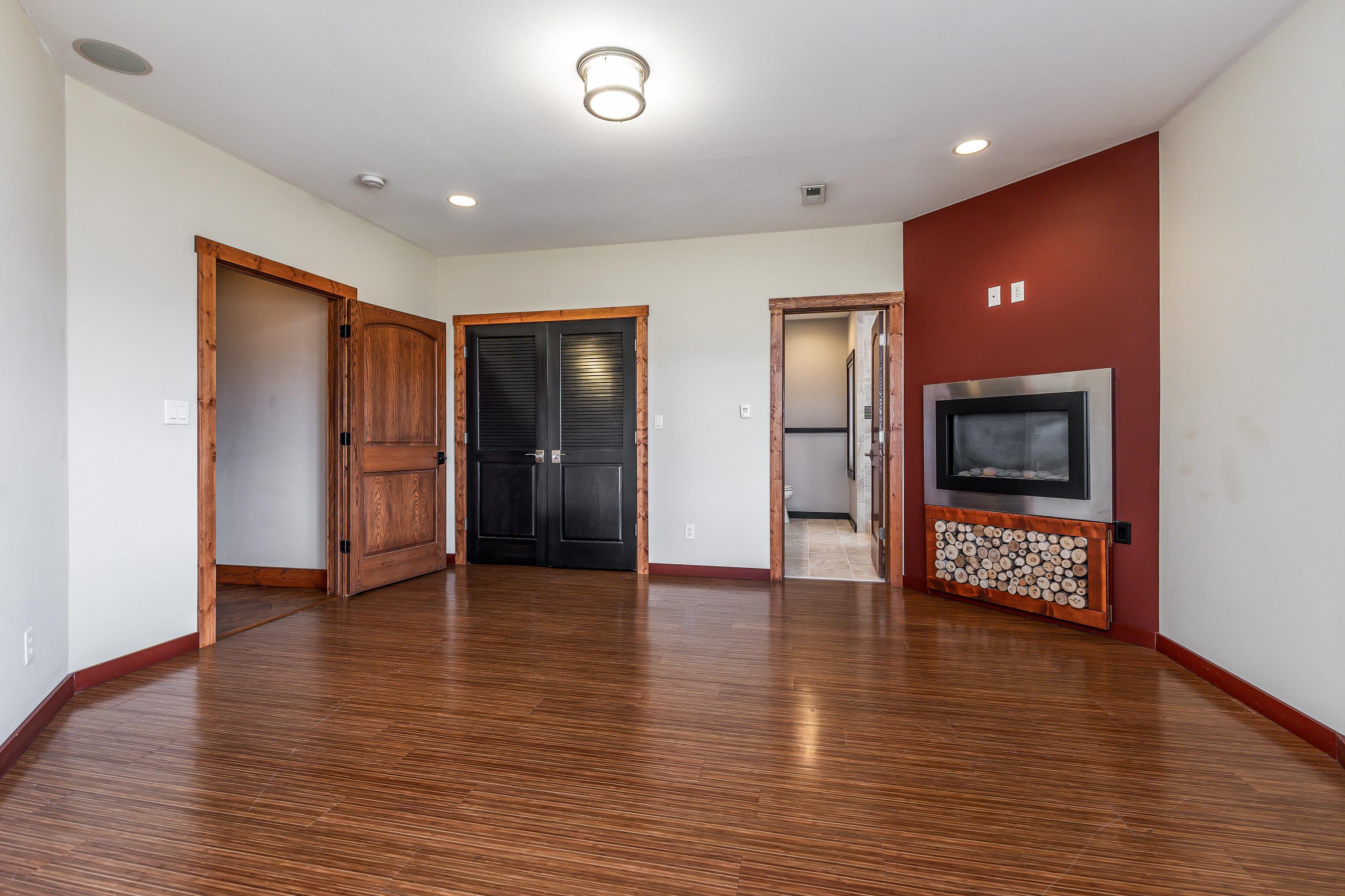 8616 Fisher Road Hanover, IL 61041 - Photo 57 of 74 an empty room with wooden floor and windows