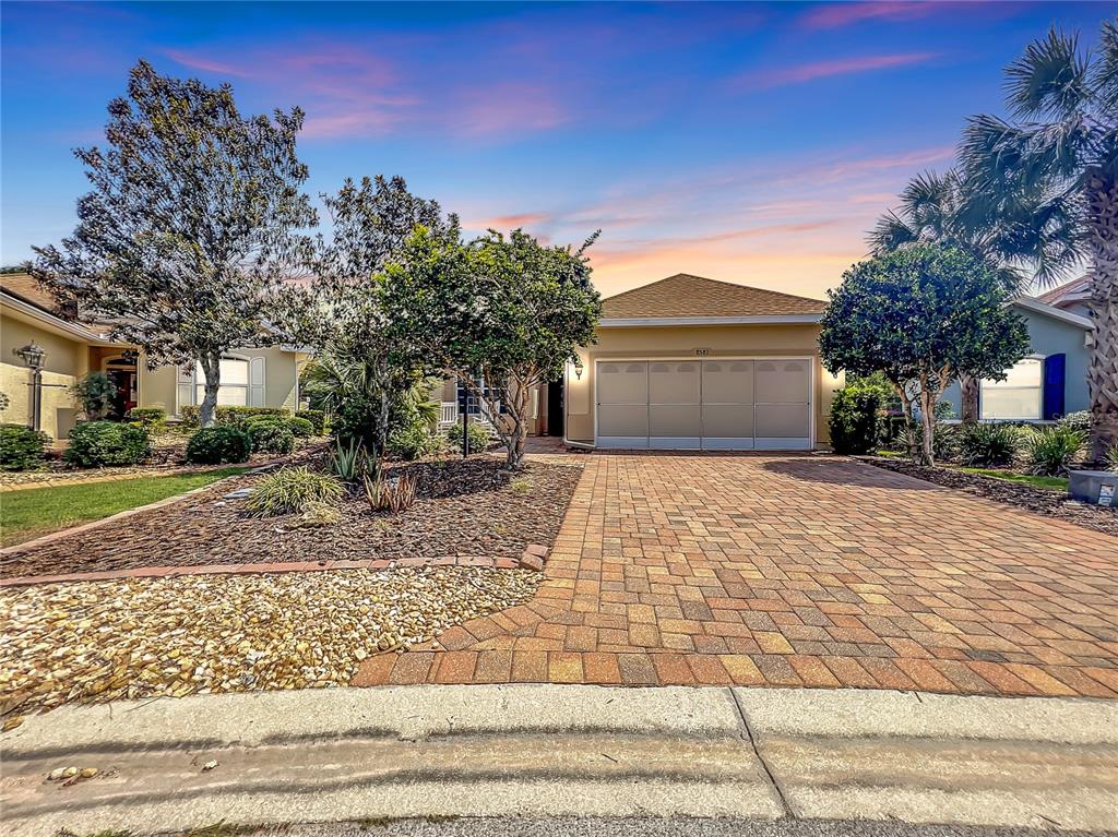 8581 Southwest 88th Loop Ocala, FL 34481 - Photo 1 of 1 a front view of a house with a yard