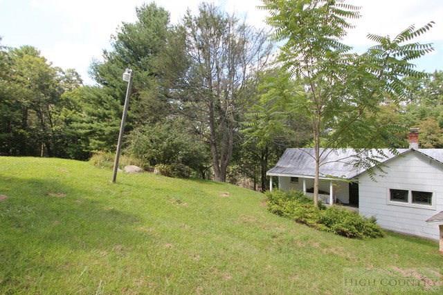 5046 Peach Bottom Road Independence, VA 24348 - Photo 6 of 13 a backyard of a house with table and chairs