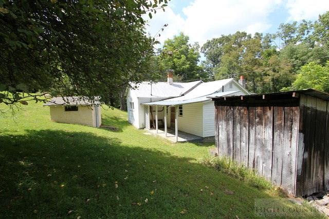 5046 Peach Bottom Road Independence, VA 24348 - Photo 8 of 13 a view of a house with backyard and sitting area