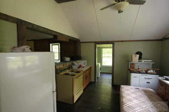 5046 Peach Bottom Road Independence, VA 24348 - Photo 9 of 13 a kitchen with stainless steel appliances a refrigerator and a stove