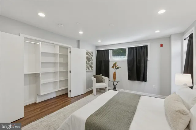 a bedroom with a bed and furniture