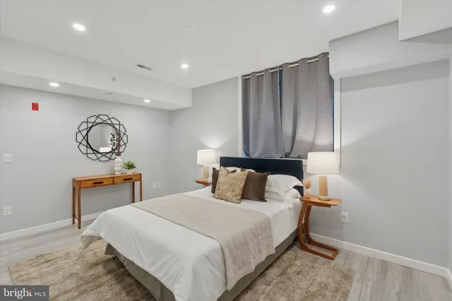 a bedroom with a bed and a table