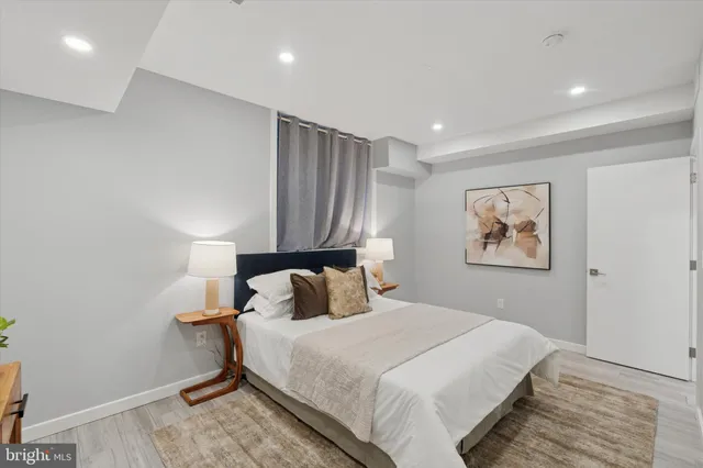 a bedroom with a large bed and a window