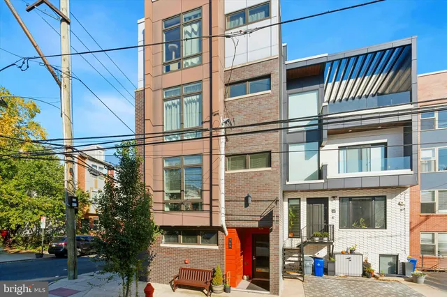 a front view of a building with a street