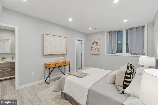 a bedroom with a bed and a dresser