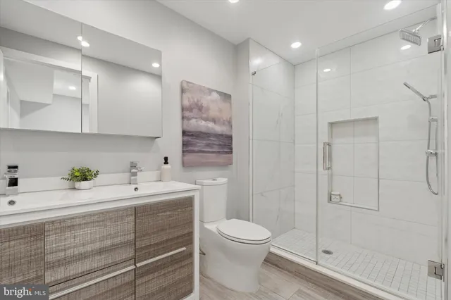 a view of bathroom with a sink a toilet and shower