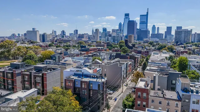 a bathroom with a double vanity sink mirror and toilet