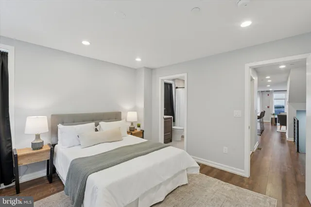 a bedroom with a bed and a view of bedroom