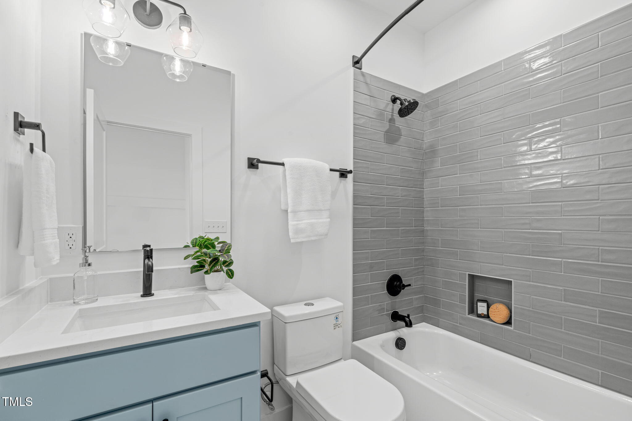 622 Rocky Knob Court Raleigh, NC 27601 - Photo 29 of 47 a bathroom with a sink a toilet and shower