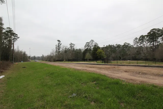 a view of field with trees in the background