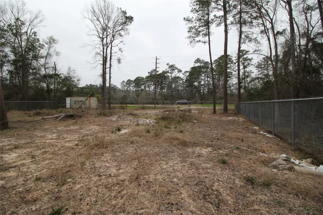 a view of outdoor space with deck and trees