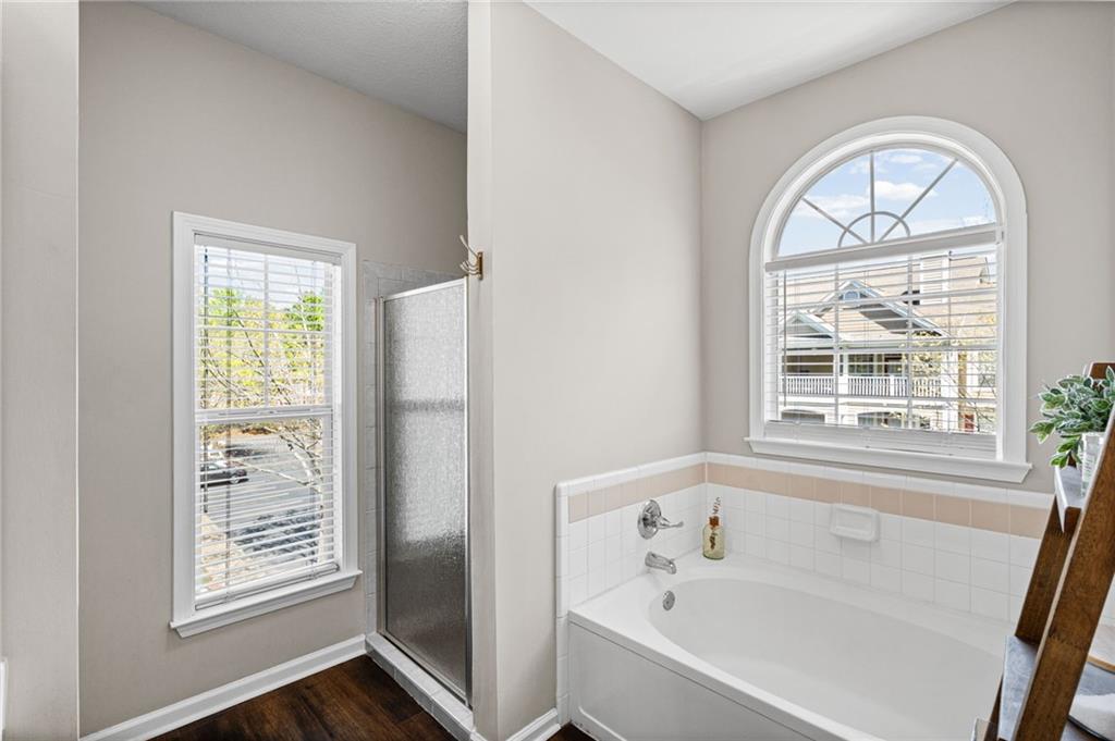 238 Edinburgh Court Alpharetta, GA 30004 - Photo 11 of 20 a white bath tub sitting next to a window