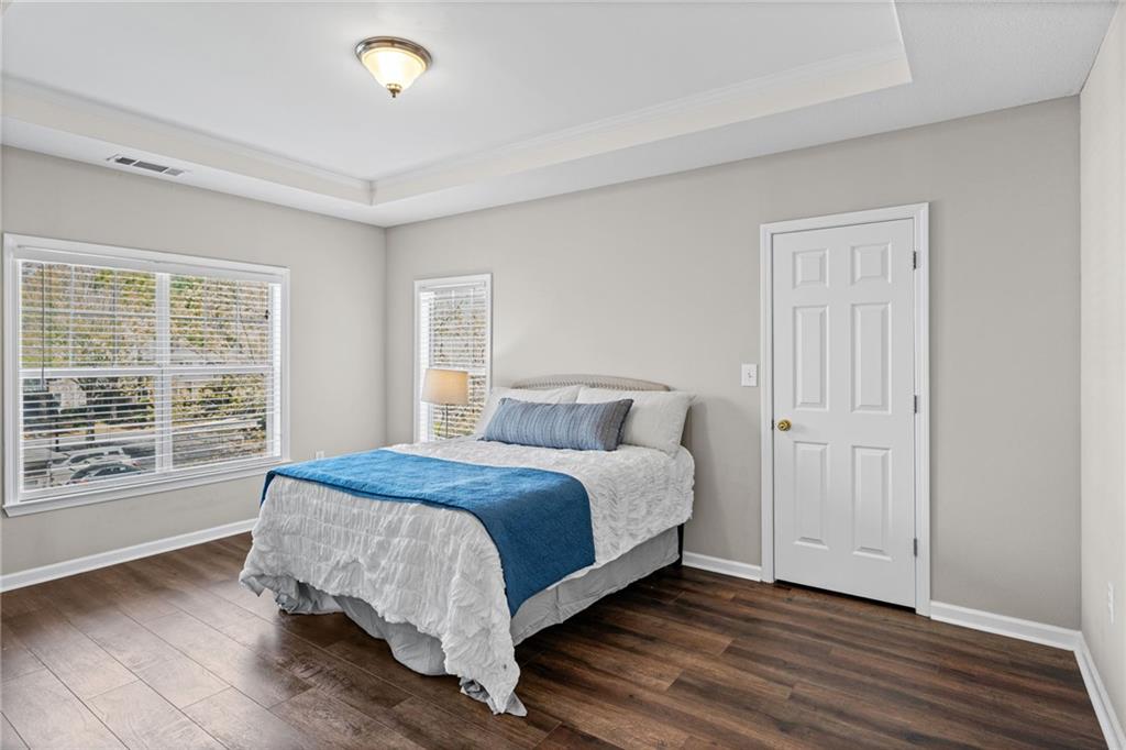 238 Edinburgh Court Alpharetta, GA 30004 - Photo 12 of 20 a bedroom with a bed and a large window