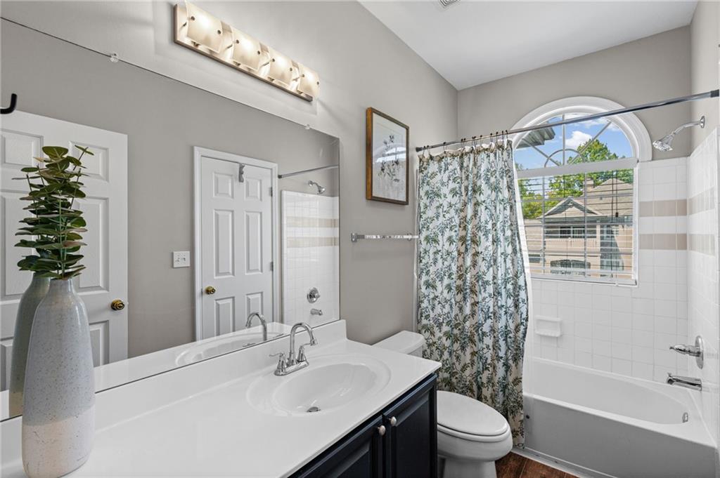 238 Edinburgh Court Alpharetta, GA 30004 - Photo 13 of 20 a bathroom with a sink toilet and shower