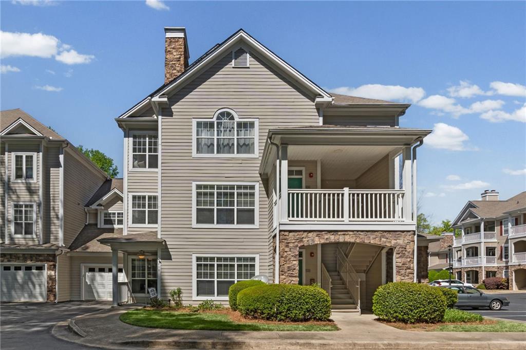 238 Edinburgh Court Alpharetta, GA 30004 - Photo 16 of 20 a front view of a house with a yard