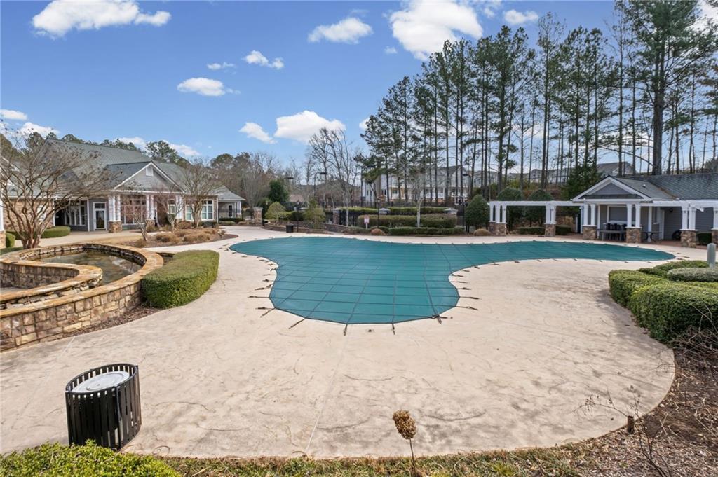 238 Edinburgh Court Alpharetta, GA 30004 - Photo 18 of 20 a view of a white house with a yard and sitting area