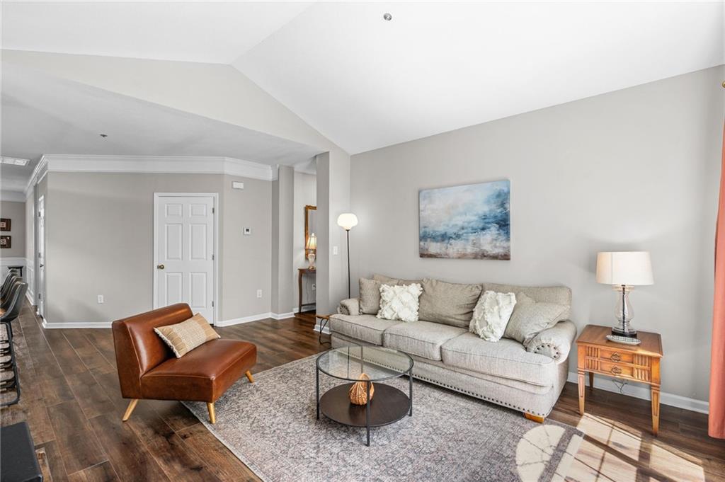 238 Edinburgh Court Alpharetta, GA 30004 - Photo 2 of 20 a living room with furniture and a potted plant on table