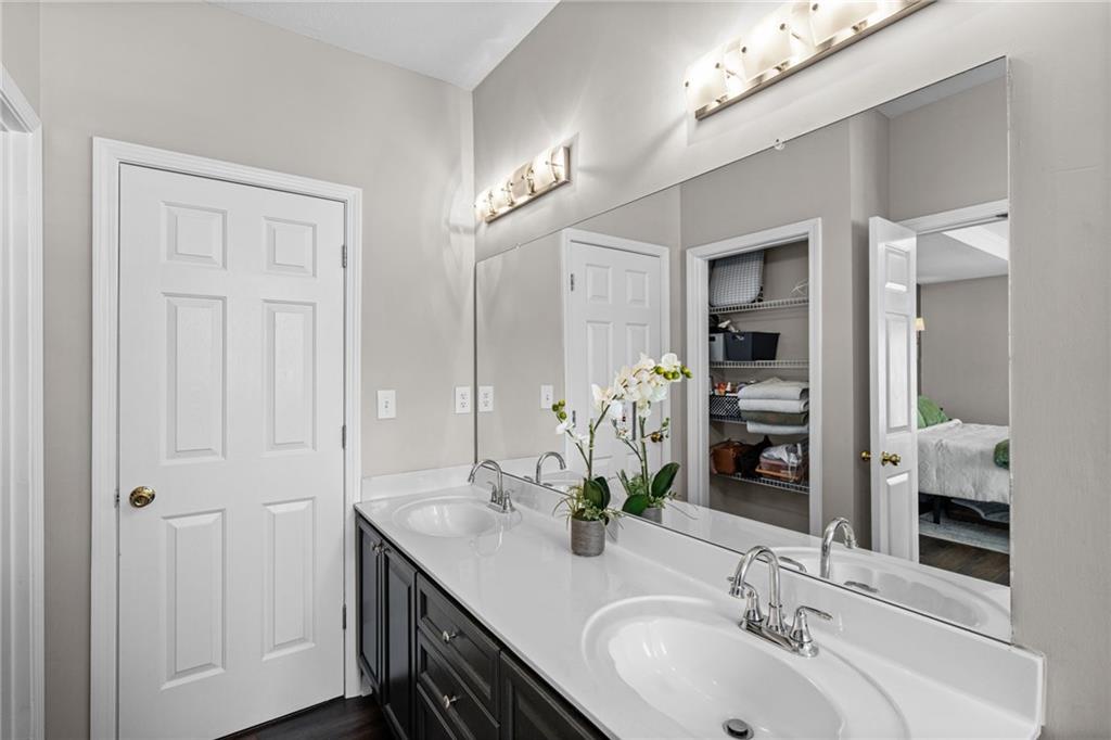 238 Edinburgh Court Alpharetta, GA 30004 - Photo 10 of 20 a bathroom with a double vanity sink and a mirror