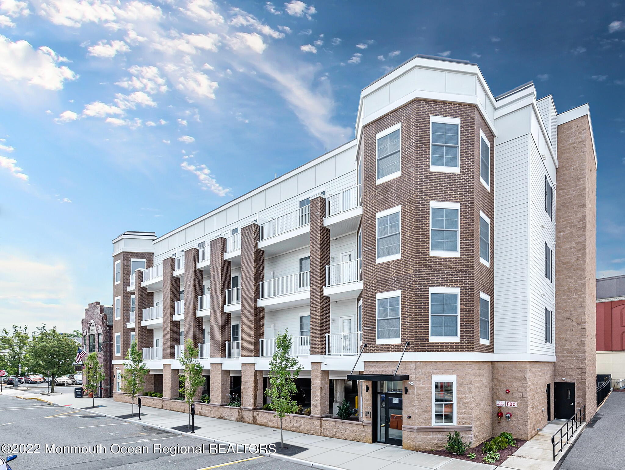a front view of a building with street view