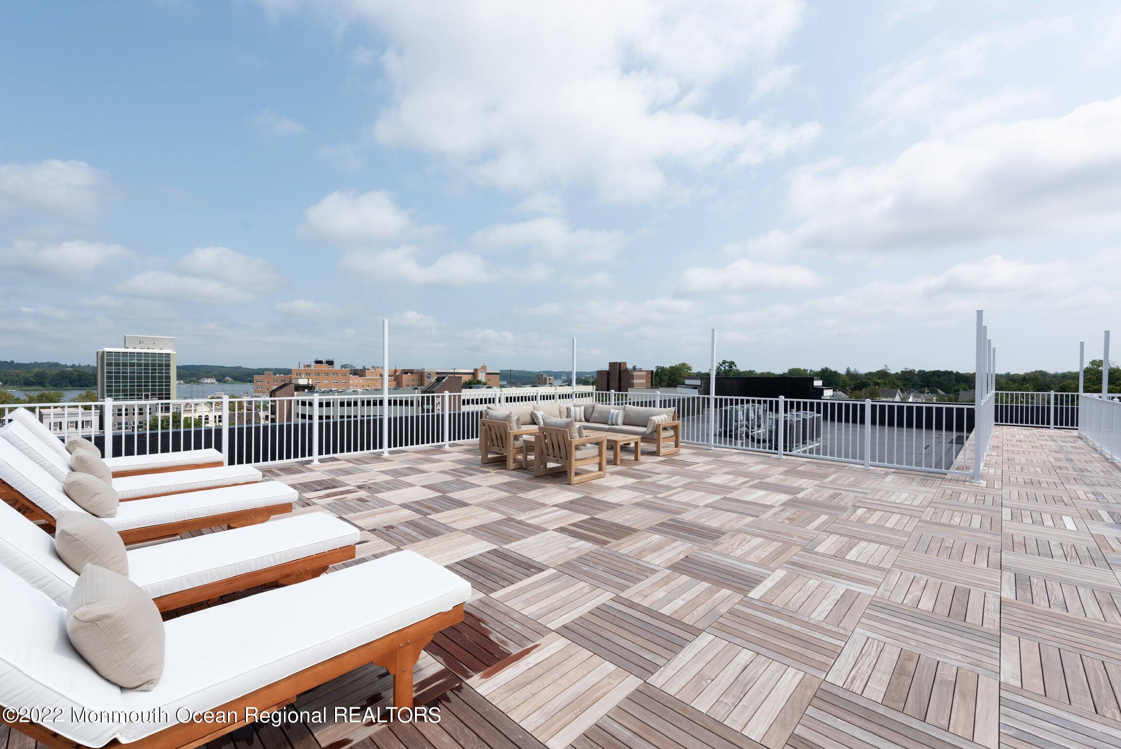 24 Mechanic Street, Unit 405 Red Bank, NJ 07701 - Photo 11 of 17 a view of a terrace with chairs