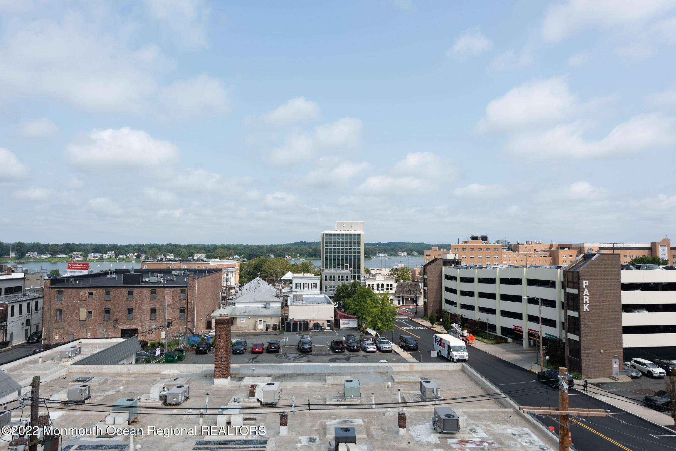 24 Mechanic Street, Unit 405 Red Bank, NJ 07701 - Photo 12 of 17 a view of a city with tall buildings