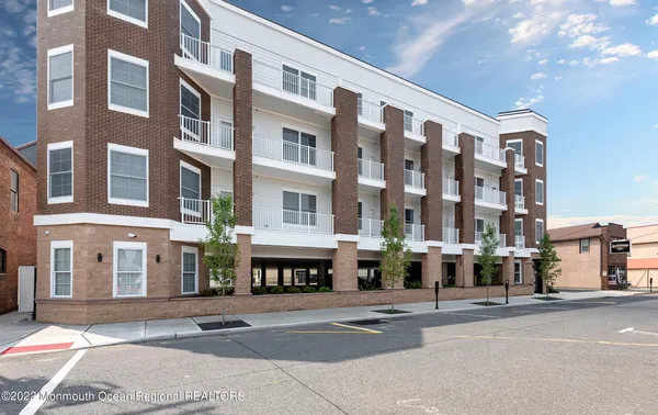 a front view of a building with street view