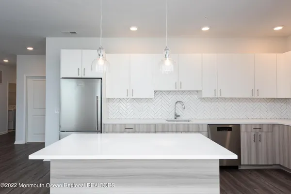 a bathroom with a bathtub and a sink