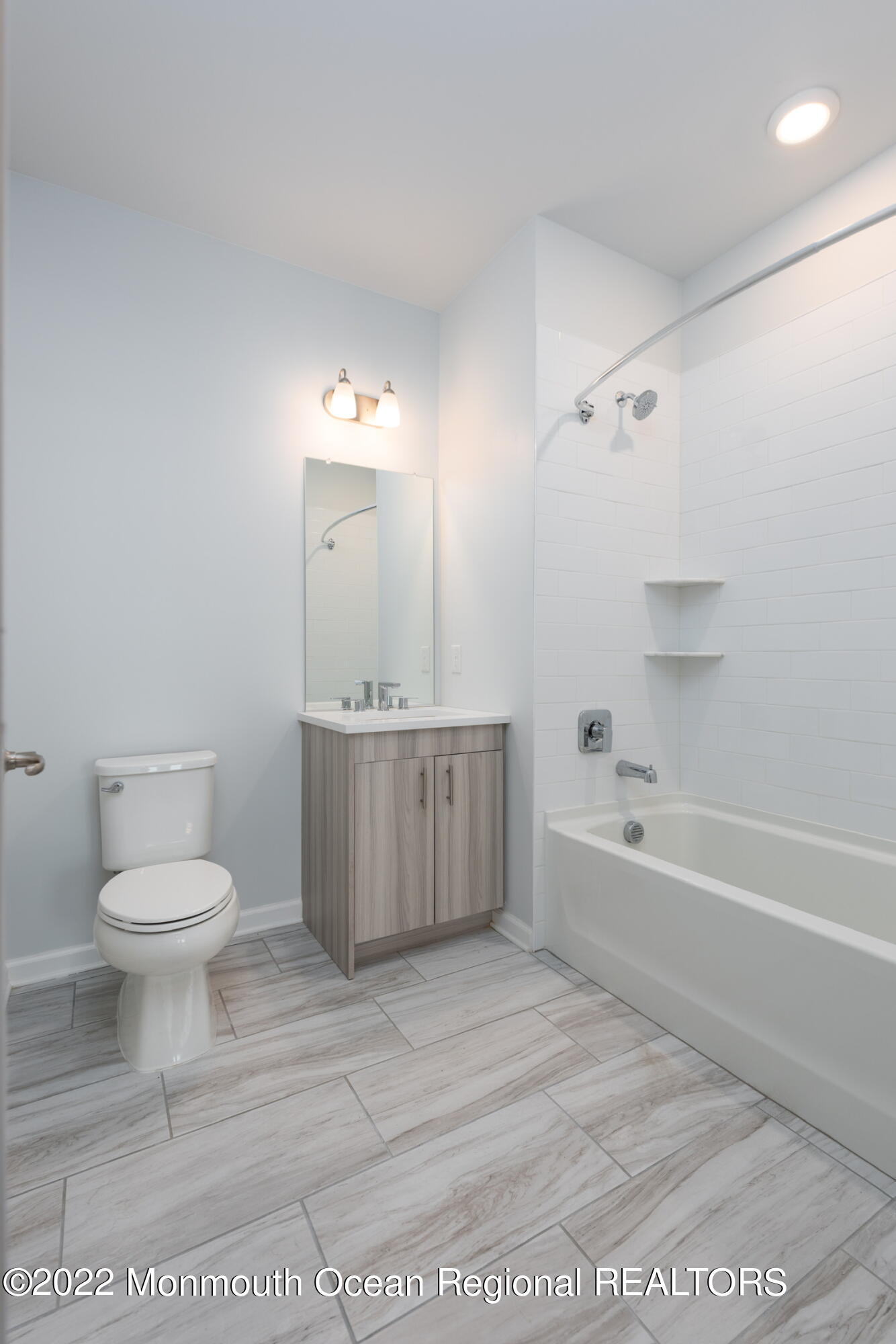 24 Mechanic Street, Unit 405 Red Bank, NJ 07701 - Photo 5 of 17 a bathroom with a sink a toilet and a bathtub