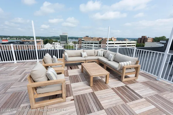 a view of roof deck with patio